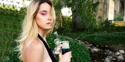 A woman enjoys the perks of erigs and dabs on the go A woman enjoys the perks of erigs and dabs on the go